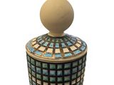 an image of a ceramic jar with a lid on a white background