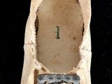 a pair of shoes that have been left on the floor