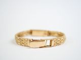 an image of a gold bracelet on a white background