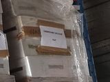 many packages of food on a shelf in a warehouse