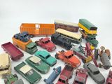 a lot of toy cars and trucks on a white surface