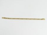 a gold bracelet with a chain that is attached to it