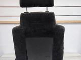 a black reclining chair that is sitting on a table