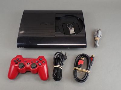 a video game console and a game controller next to each other