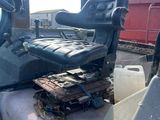 an image of a tractor with a seat that has been left on the ground