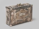 an old suitcase that is sitting on a table