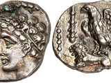 a silver coin with an eagle on top of it
