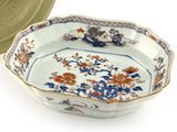 a bowl and a plate sitting next to each other on a table