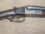 an old gun that is laying on a table
