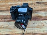 a camera that is sitting on a wooden table