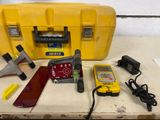 a yellow case with tools on it sitting on a table