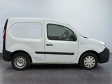 a white van with a black stripe parked in a parking lot