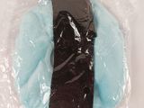 a pair of socks in a plastic bag on a table