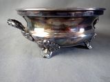 a silver bowl that is sitting on a table