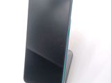 a cell phone that is sitting on top of a stand