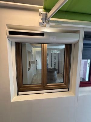 a small window in the corner of a room