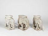 three elephant stools made out of wicker and rope on a white background