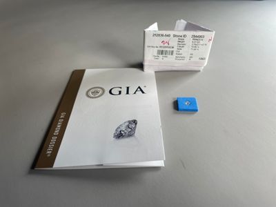 a book with a picture of a diamond on it next to a pair of dice