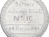 a close up of a silver coin on a white background