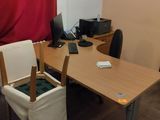 a desk with a chair and a computer on it