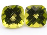 two square cut green quartz gems on a white background