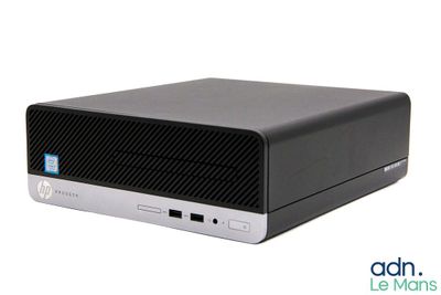 the hp desktop computer is sitting on a white surface