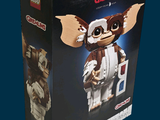 a box that has a lego gremo figure in it