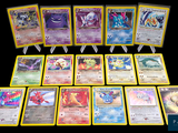a lot of pokemon cards that are sitting on a table