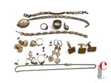 an image of a collection of antique jewelry on a white background