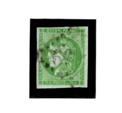 un timbre vert sur lequel figure l'image d'une femme