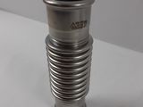 a metal vase that has a spiral design on it