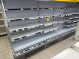 many empty shelves in the store for sale
