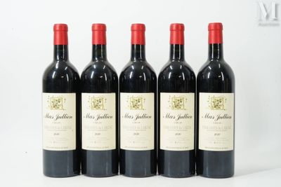 four bottles of red wine are lined up in a row
