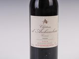a bottle of wine that is sitting on a table