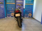 a motorcycle that is parked in front of a wall