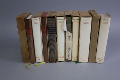 several books are stacked on top of each other on a table