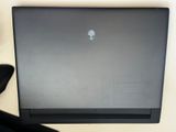 a laptop that is sitting on a desk next to a keyboard