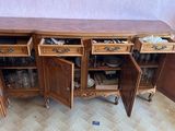 a wooden cabinet with two drawers and a door open