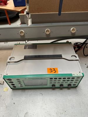 a machine that is sitting on the floor next to a table