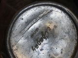 a person holding a metal object in their hand