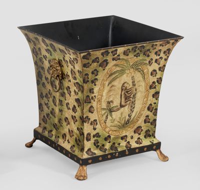 jardinière à motif léopard avec un socle noir et doré