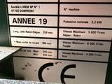 a label on the side of a machine that is sitting on the floor