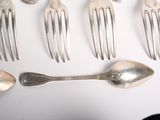 five spoons and six spoons on a white table