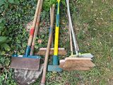 a lot of tools that are laying out in the grass