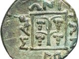 a close up of a coin with a picture of people on it