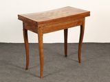 a small wooden table with a drawer on it