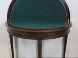an image of a small table with a green seat