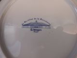 a white plate with a blue and white design on it
