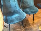 two chairs that are sitting next to each other on the floor