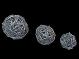three balls of yarn are shown on a black background